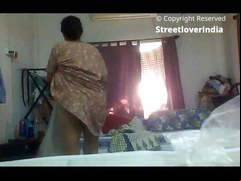 Sexy Indian Bengali Aunt Mili captured changing in bedroom